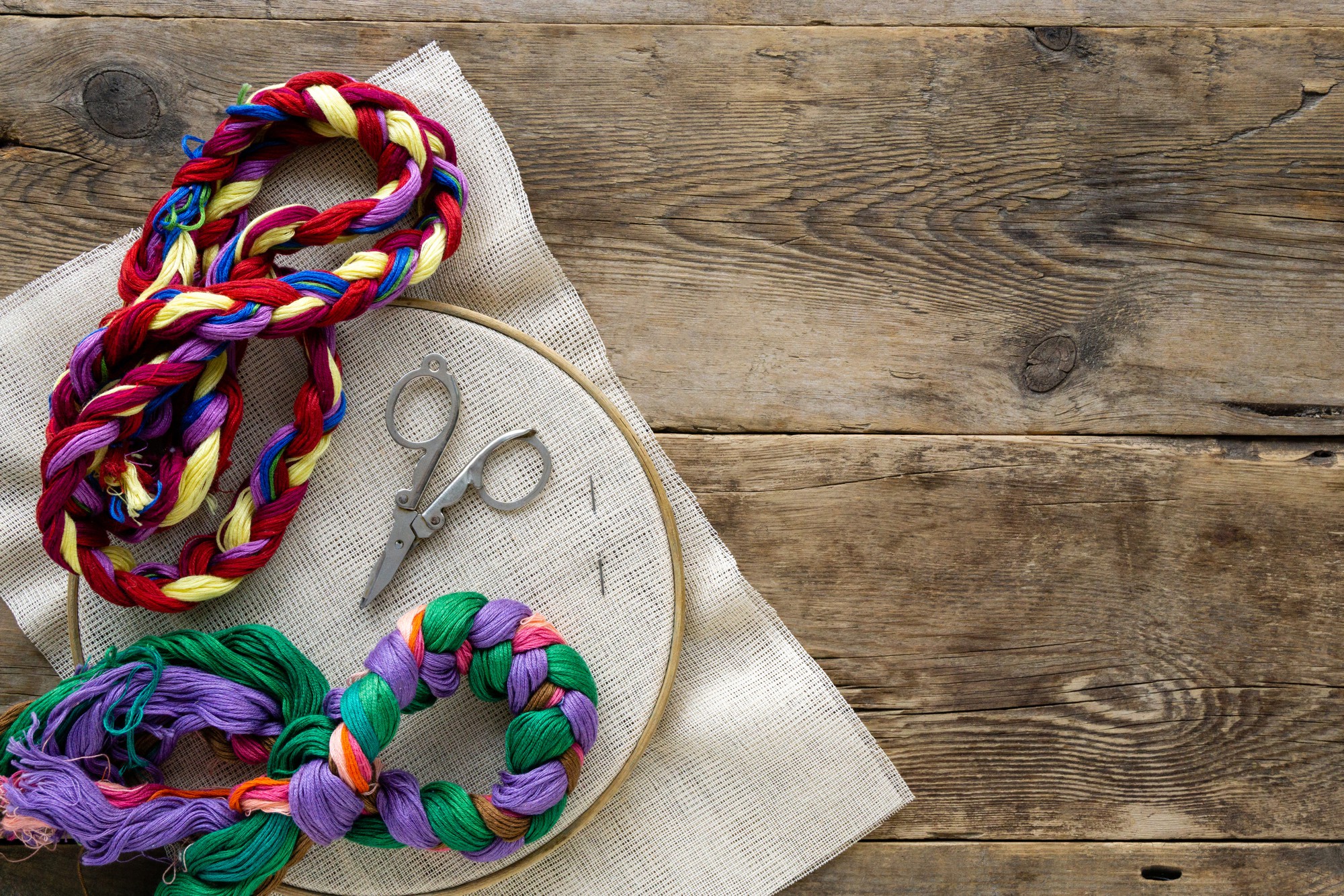 flatlay of embroidered samples and tools